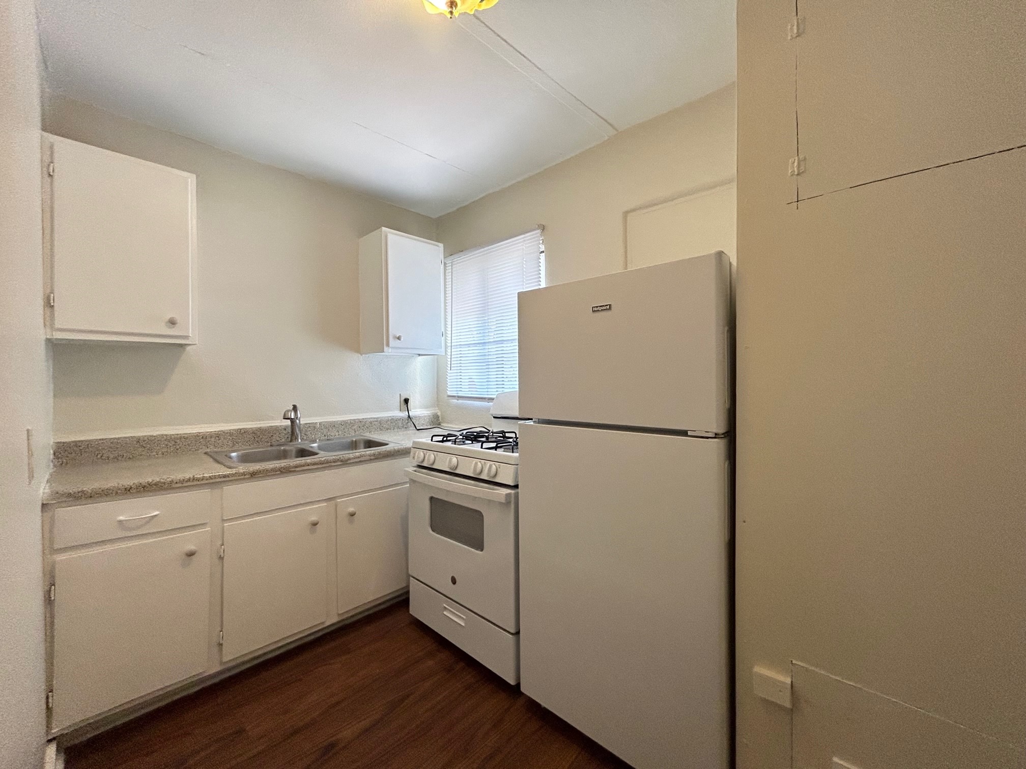 2717 Hadley Street, Unit 16 Houston, TX 77004 - Photo 18 of 27 a white refrigerator freezer sitting inside of a kitchen