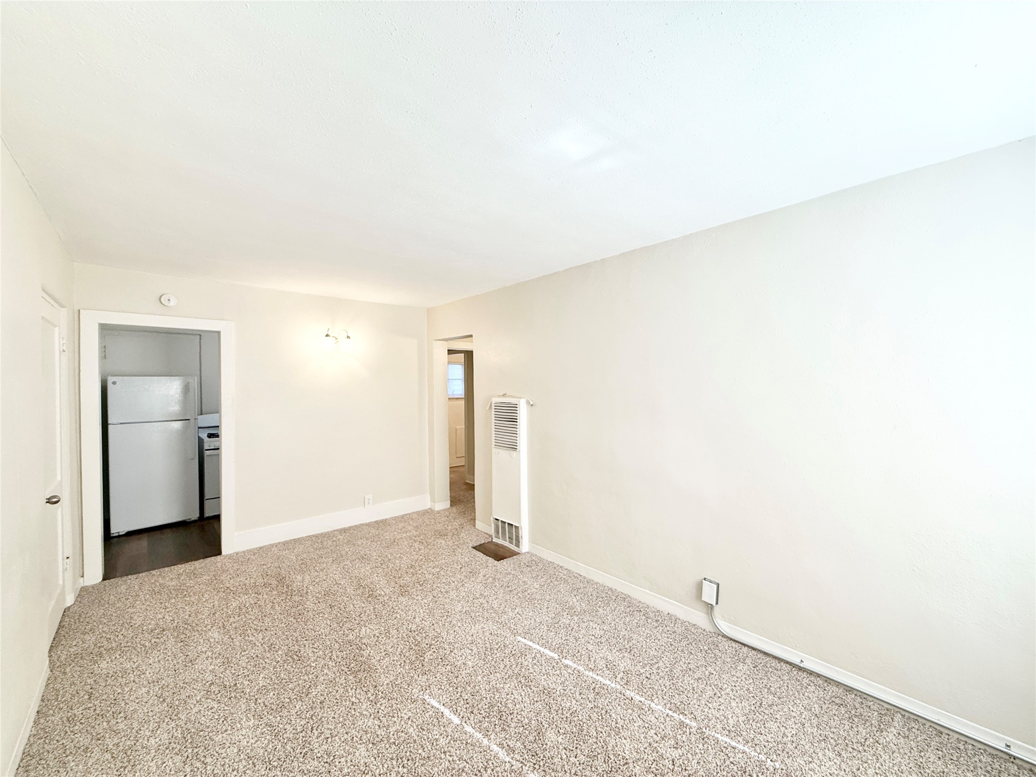 2717 Hadley Street, Unit 16 Houston, TX 77004 - Photo 2 of 27 a view of a room with closet and wooden floor