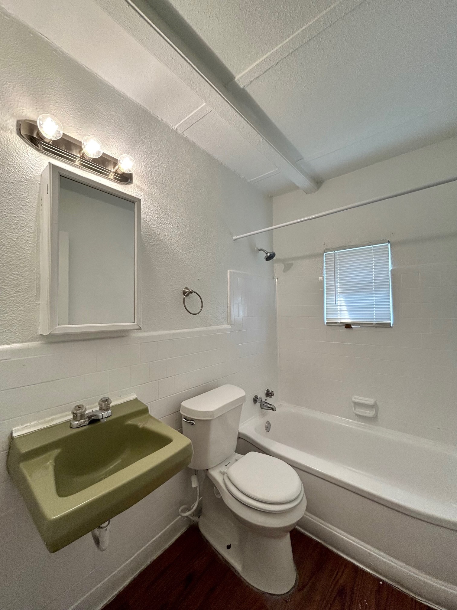 2717 Hadley Street, Unit 16 Houston, TX 77004 - Photo 23 of 27 a bathroom with a sink a toilet and bathtub
