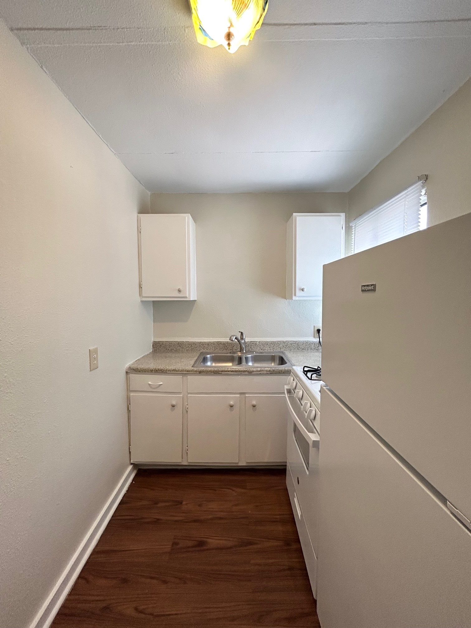 2717 Hadley Street, Unit 16 Houston, TX 77004 - Photo 27 of 27 a kitchen with sink refrigerator and stove
