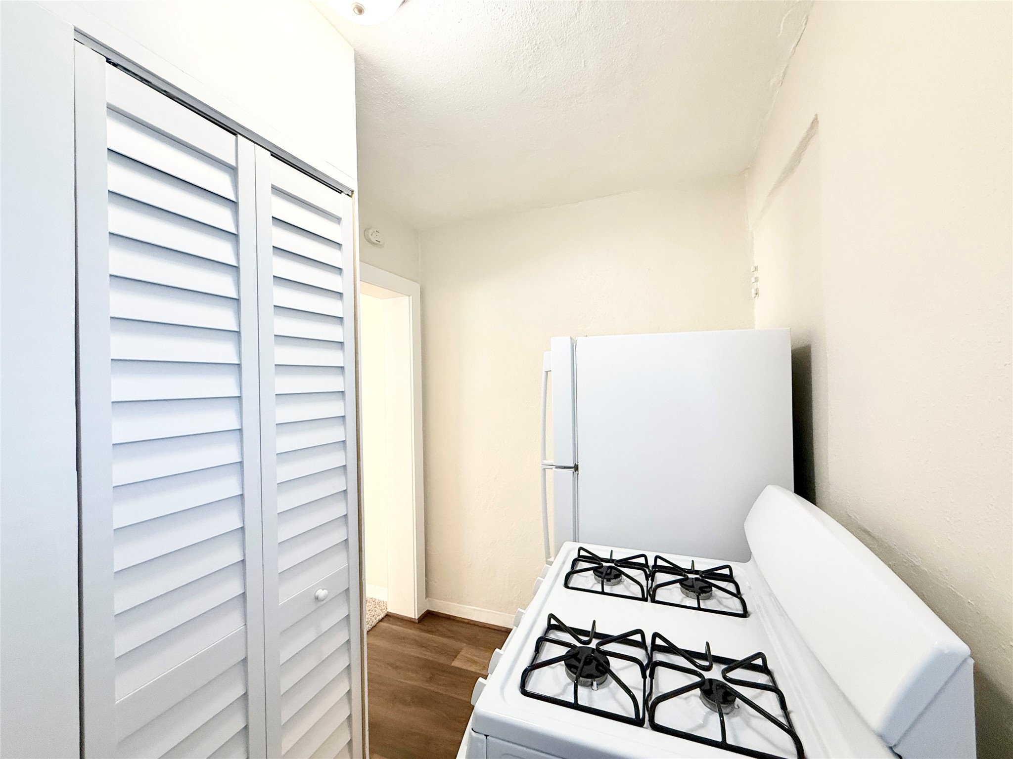 2717 Hadley Street, Unit 16 Houston, TX 77004 - Photo 6 of 27 a view of a bedroom with wooden floor