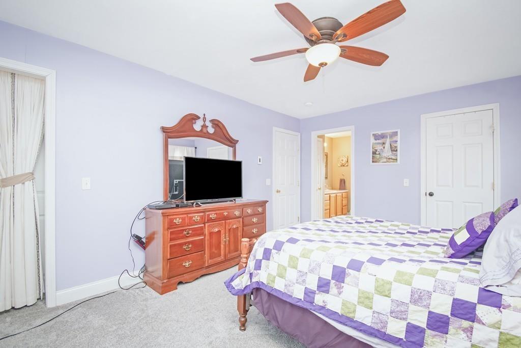 602 Southbridge Road Warren, MA 01083 - Photo 28 of 42 a bedroom with a bed and a flat screen tv