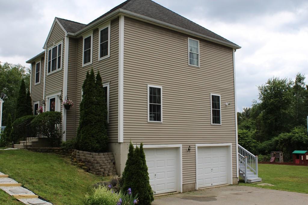 602 Southbridge Road Warren, MA 01083 - Photo 42 of 42 a front view of a house with garden