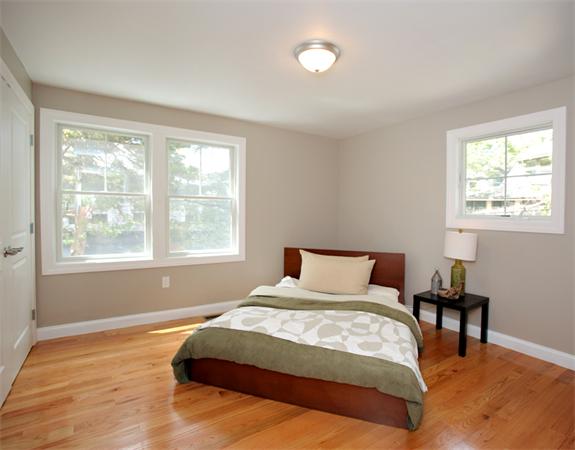 7 Lake Road Wellesley, MA 02482 - Photo 13 of 24 a bedroom with a bed a table and windows
