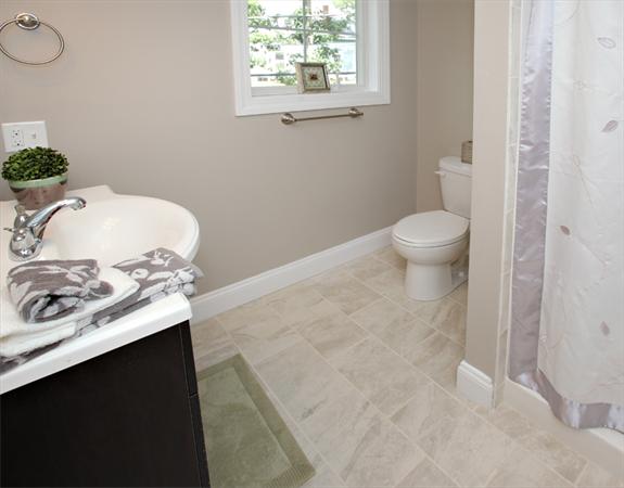 7 Lake Road Wellesley, MA 02482 - Photo 15 of 24 a bathroom with a sink toilet and a mirror