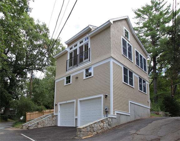 7 Lake Road Wellesley, MA 02482 - Photo 19 of 24 a front view of a house with a tree