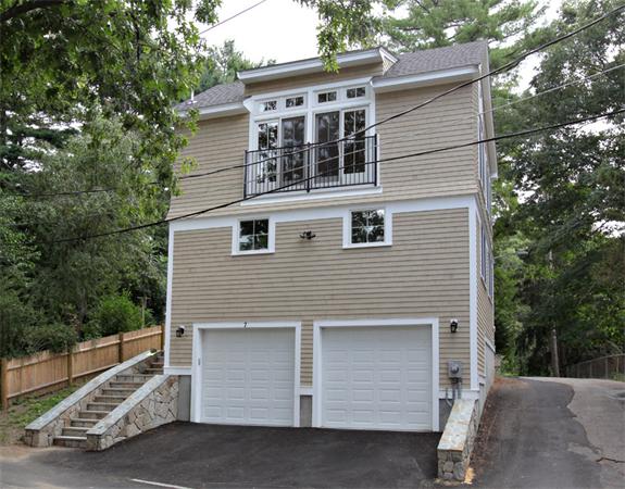 7 Lake Road Wellesley, MA 02482 - Photo 20 of 24 a front view of a house with garage