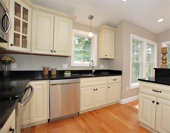 7 Lake Road Wellesley, MA 02482 - Photo 6 of 24 a kitchen with stainless steel appliances granite countertop a stove a sink and white cabinets