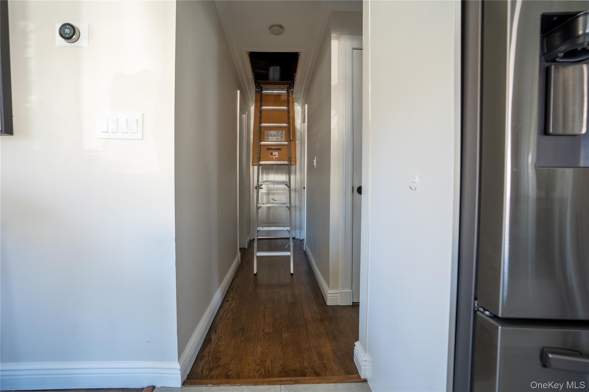 222-36 41st Road Queens, NY 11361 - Photo 15 of 21 a view of a hallway with wooden floor