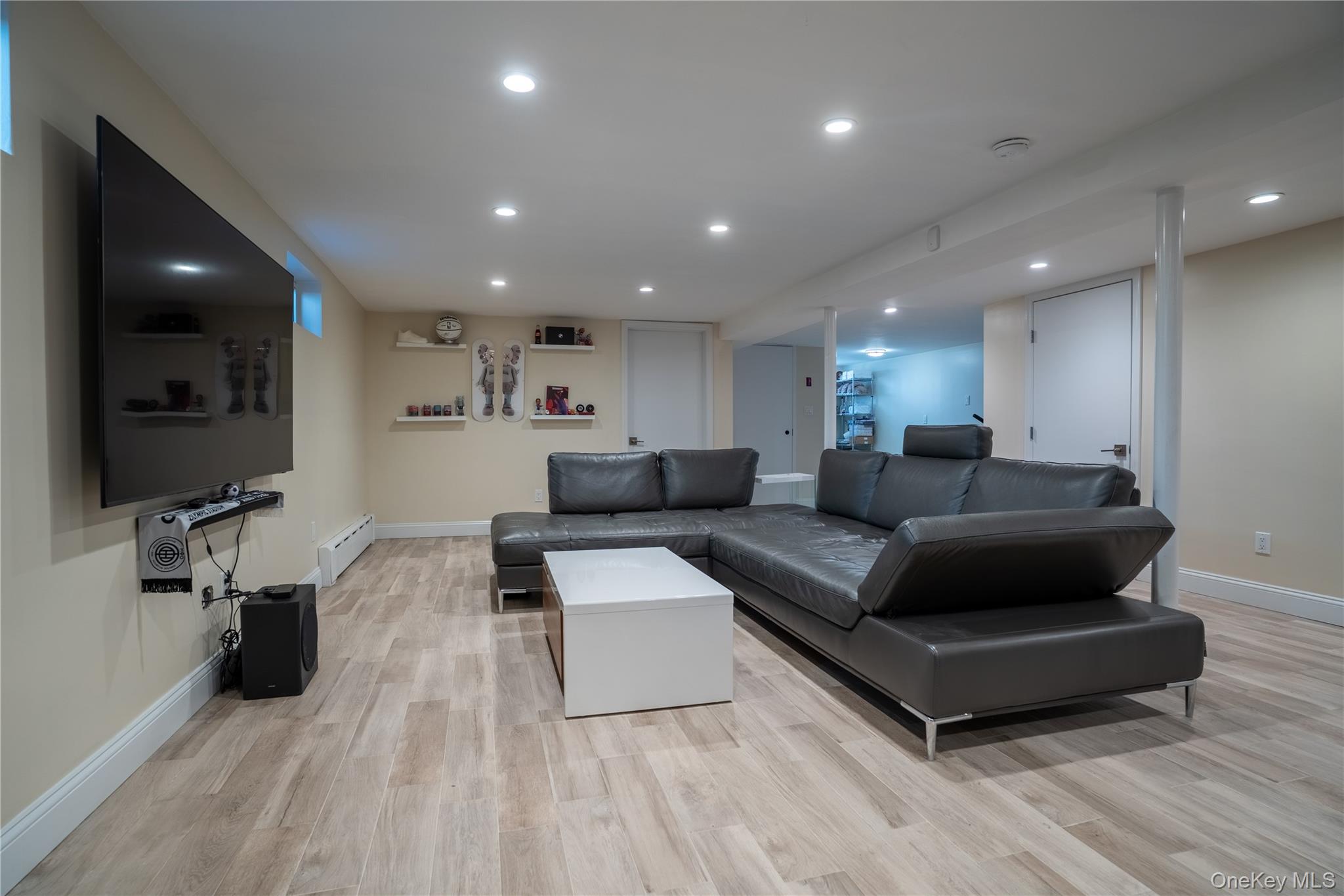 222-36 41st Road Queens, NY 11361 - Photo 16 of 21 a living room with furniture and a flat screen tv