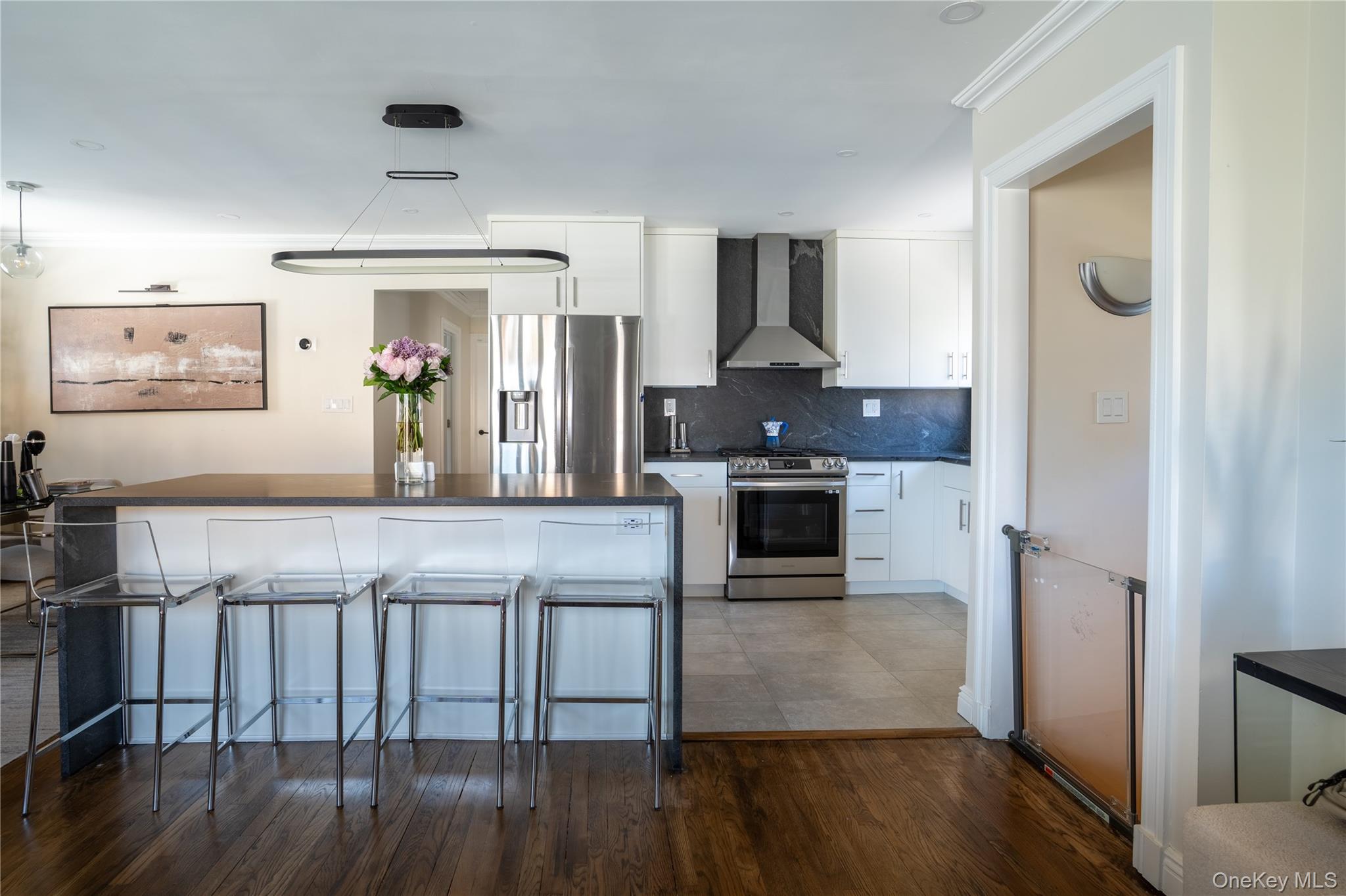 222-36 41st Road Queens, NY 11361 - Photo 2 of 21 a kitchen with stainless steel appliances granite countertop a stove and a refrigerator