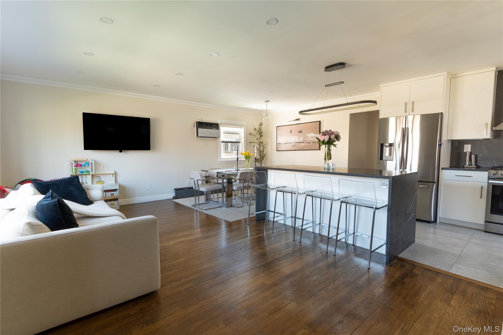 222-36 41st Road Queens, NY 11361 - Photo 3 of 21 a living room with furniture and a flat screen tv