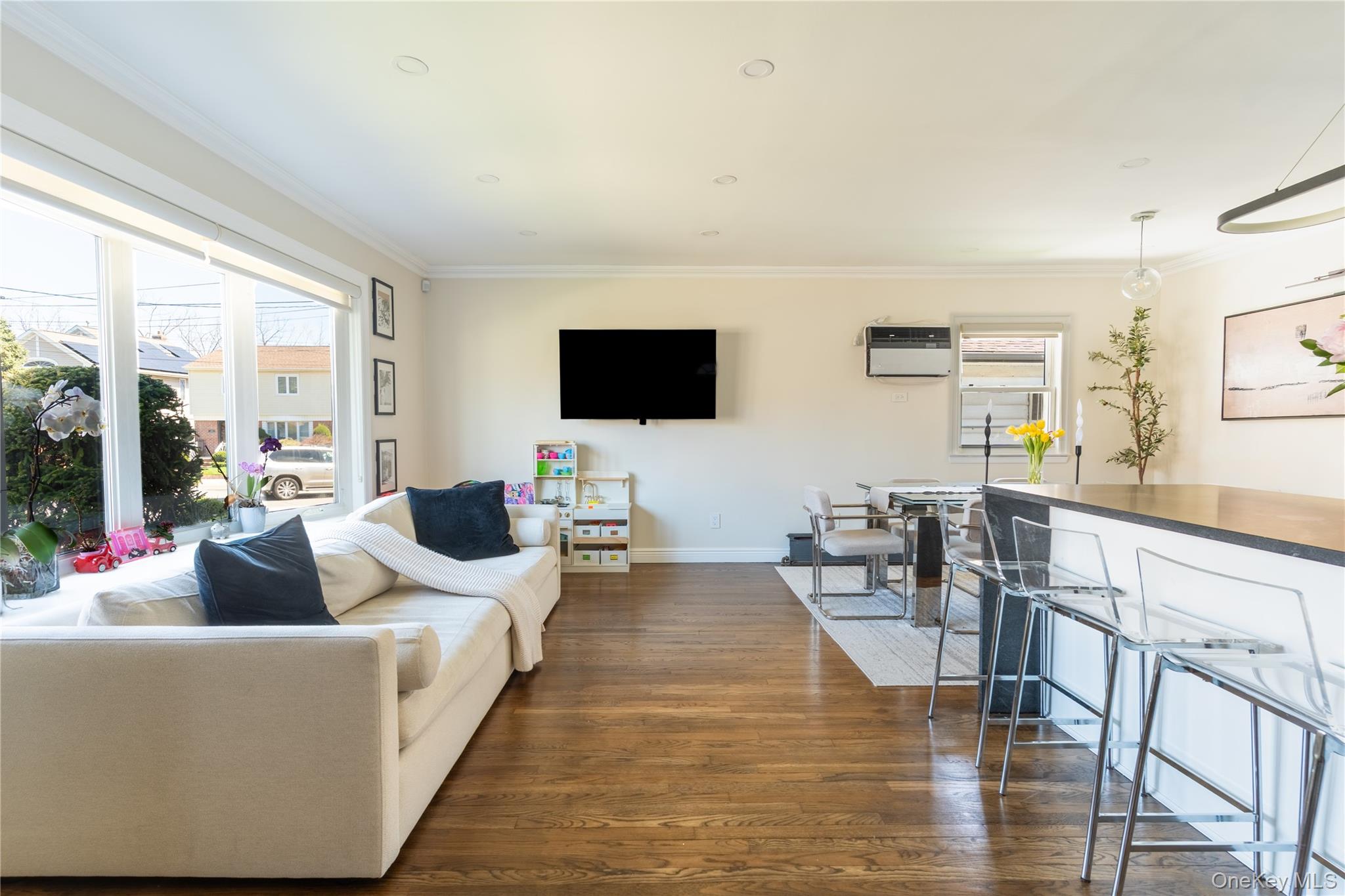 222-36 41st Road Queens, NY 11361 - Photo 5 of 21 a living room with furniture wooden floor and a flat screen tv