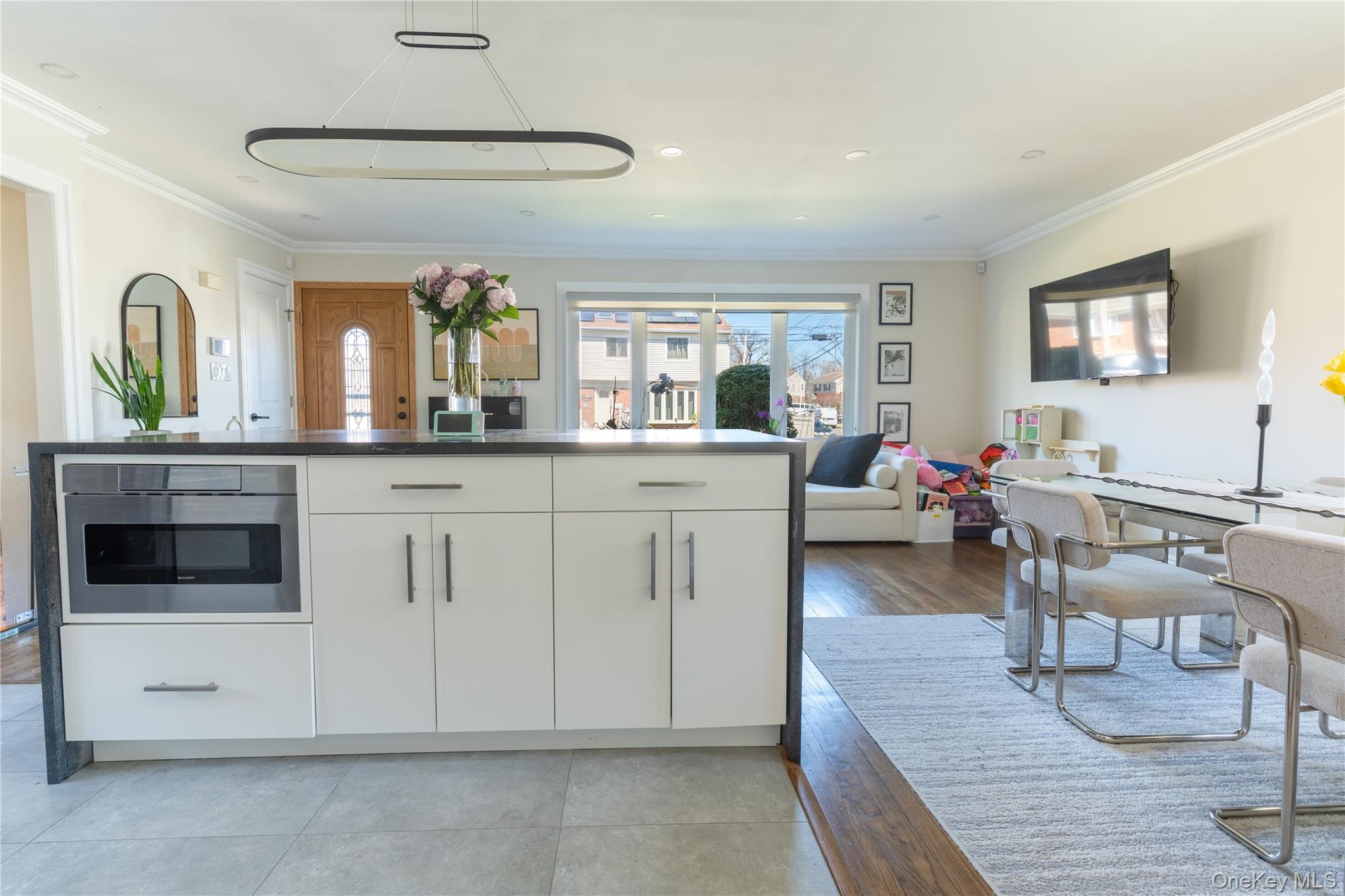 222-36 41st Road Queens, NY 11361 - Photo 6 of 21 a living room with furniture and window