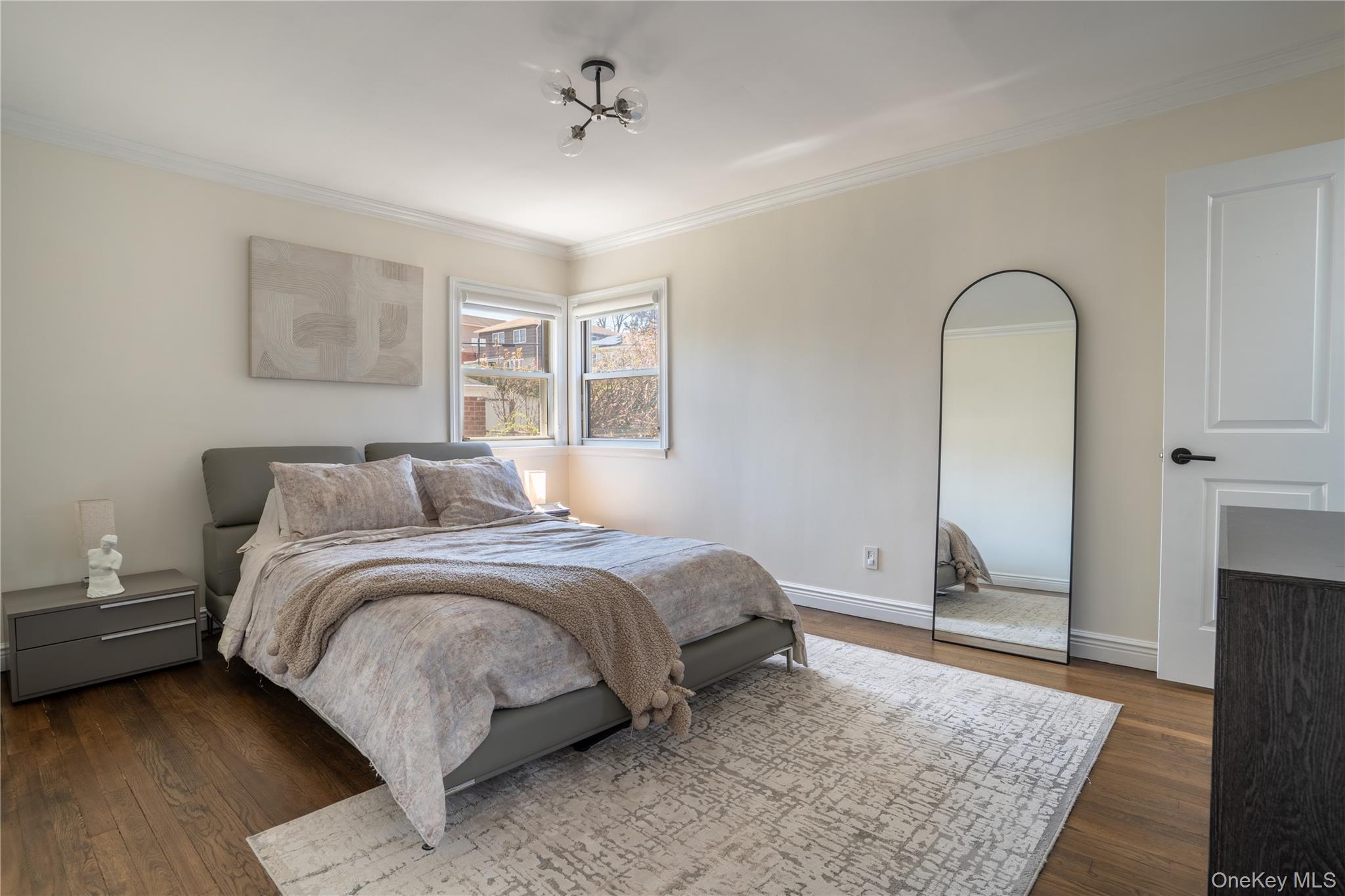 222-36 41st Road Queens, NY 11361 - Photo 8 of 21 a spacious bedroom with a bed and a dresser