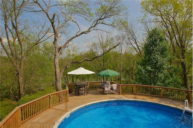 606 Riverside Drive Columbia, TN 38401 - Photo 20 of 20 Breathtaking view from upper deck of pool, park like back yard and the Duck River. Sit and enjoy the peace and nature’s tranquility