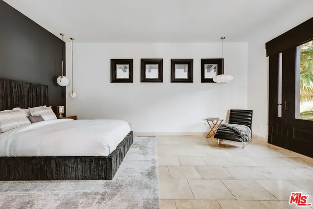 a bed room with a bed and a couch