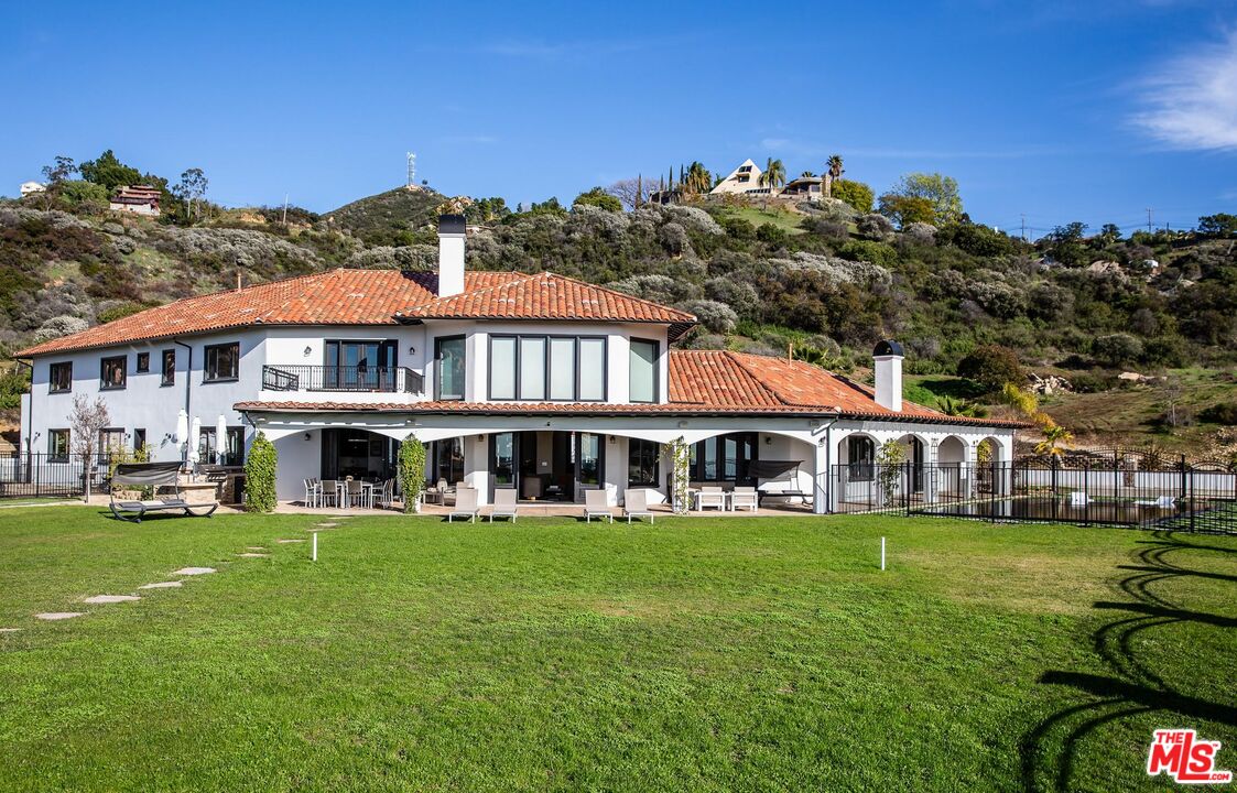 24573 Piuma Road Malibu, CA 90265 - Photo 2 of 30 a view of a house with garden and trees
