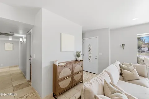 a bedroom with furniture and a window