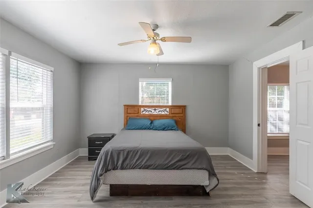 a bedroom with a bed and window