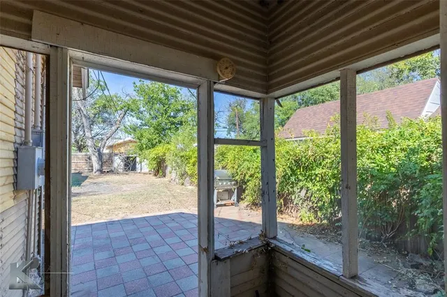 a view of a porch and garden