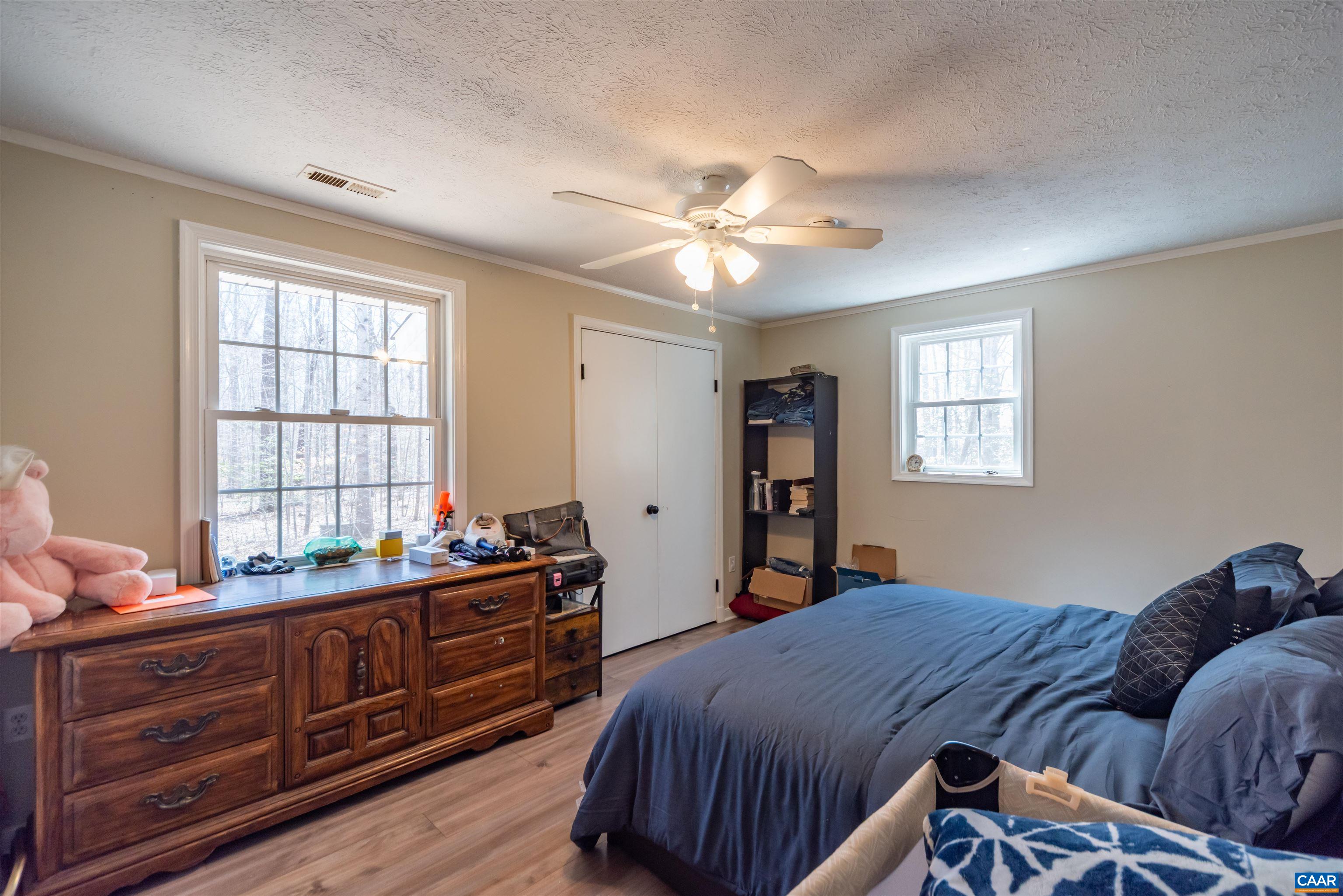 950 Apple Grove Road Mineral, VA 23117 - Photo 16 of 37 a bedroom with a bed and a dresser