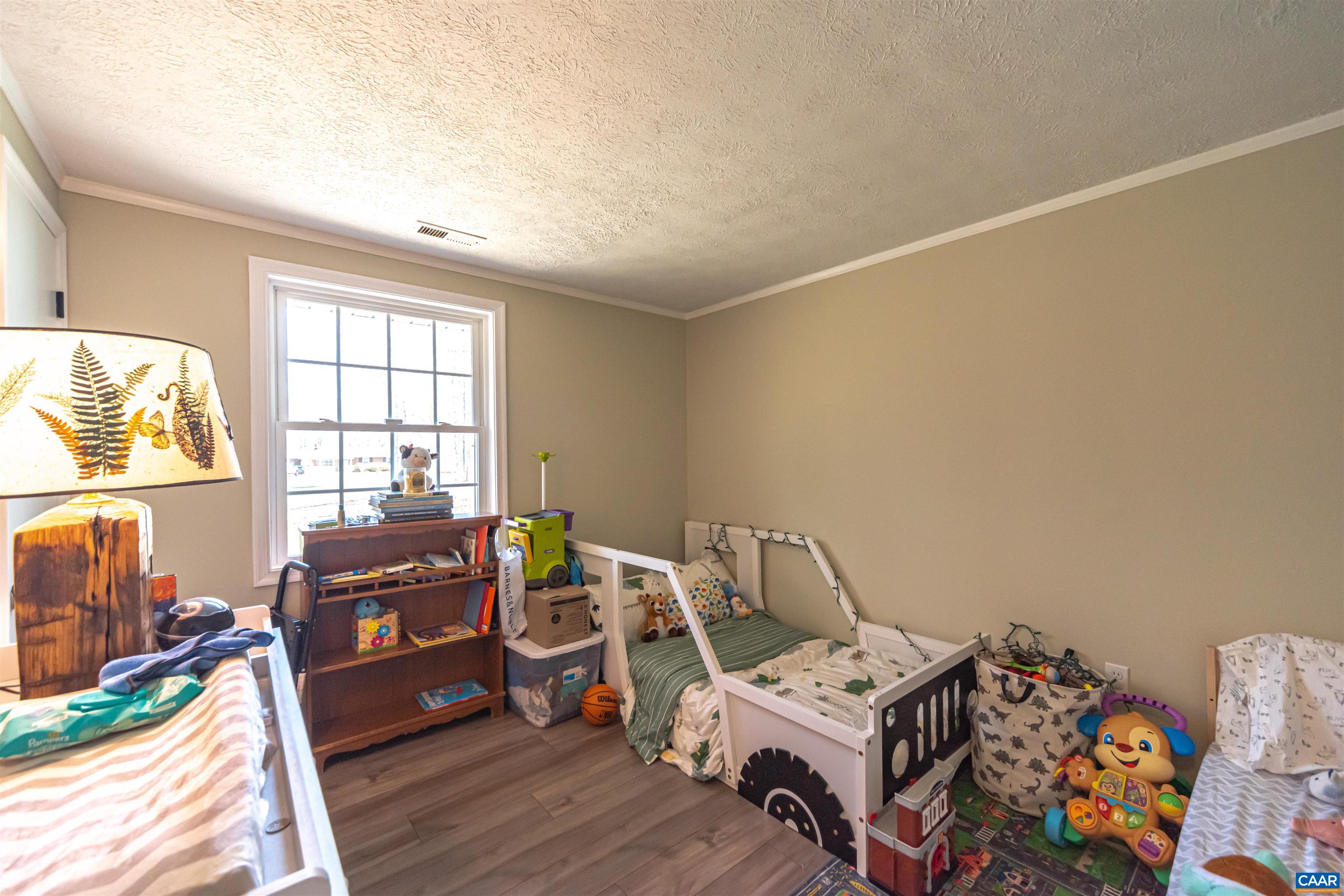 950 Apple Grove Road Mineral, VA 23117 - Photo 24 of 37 a bedroom with furniture and a wooden floor