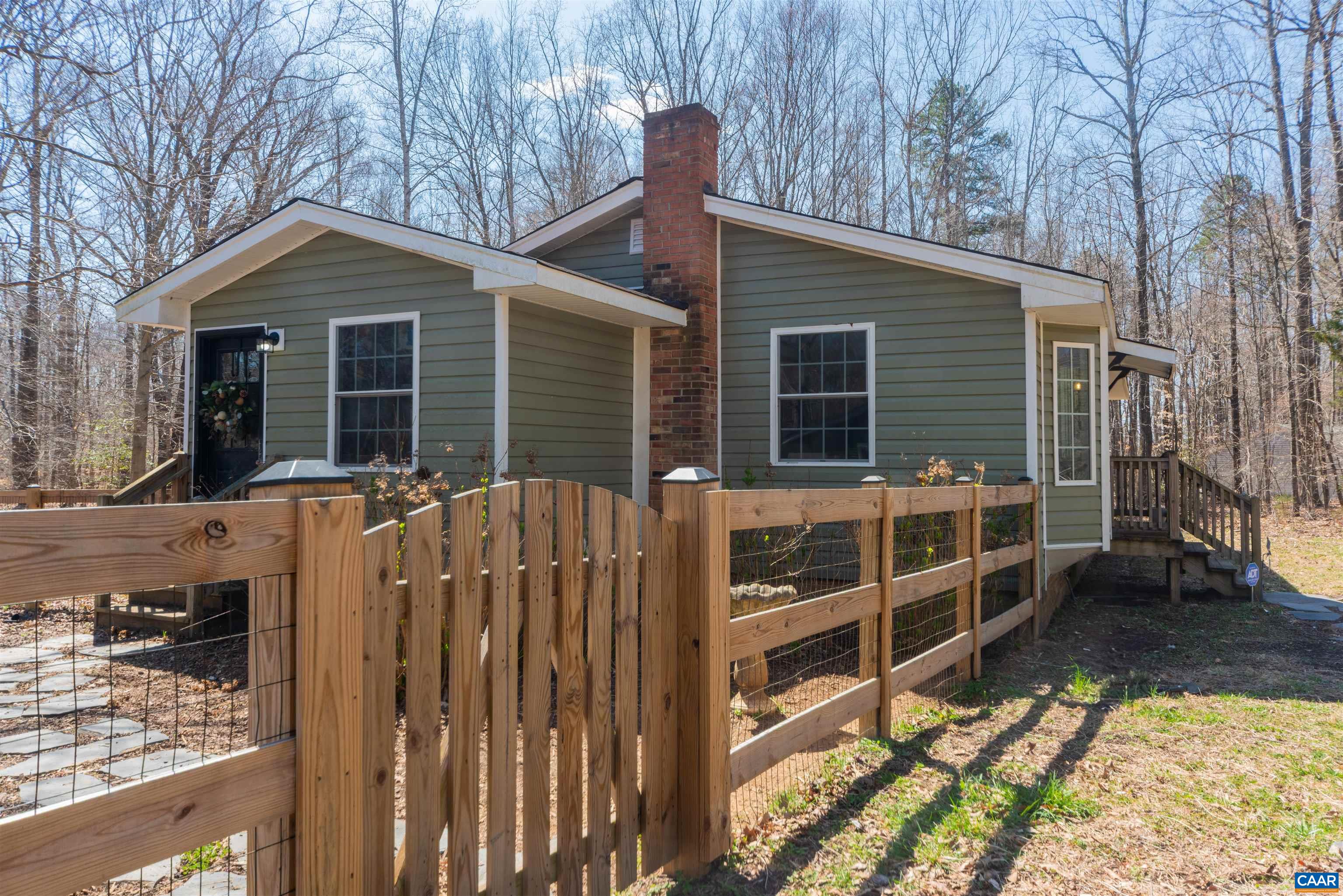 950 Apple Grove Road Mineral, VA 23117 - Photo 3 of 37 a view of house with a large window and wooden fence