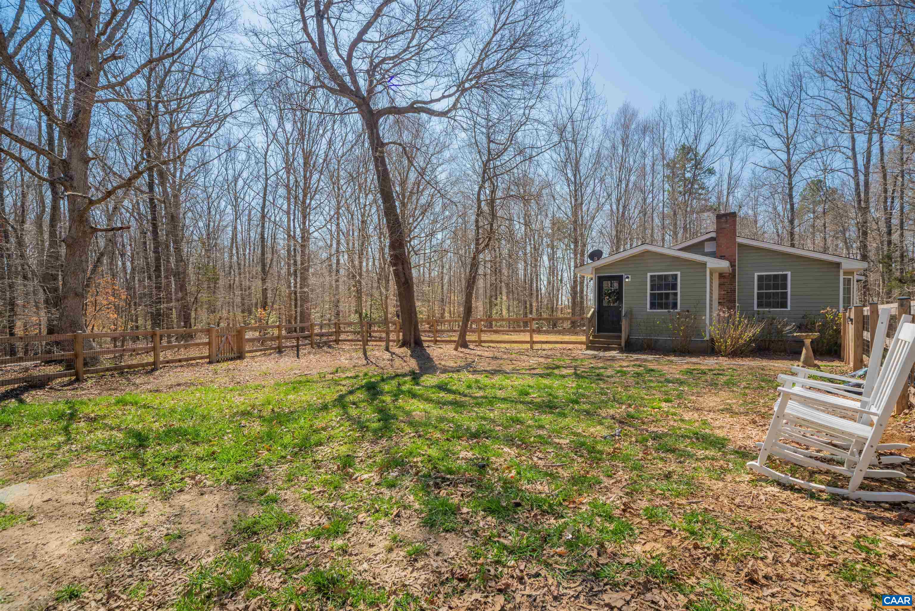950 Apple Grove Road Mineral, VA 23117 - Photo 32 of 37 a backyard of a house with large trees and outdoor seating