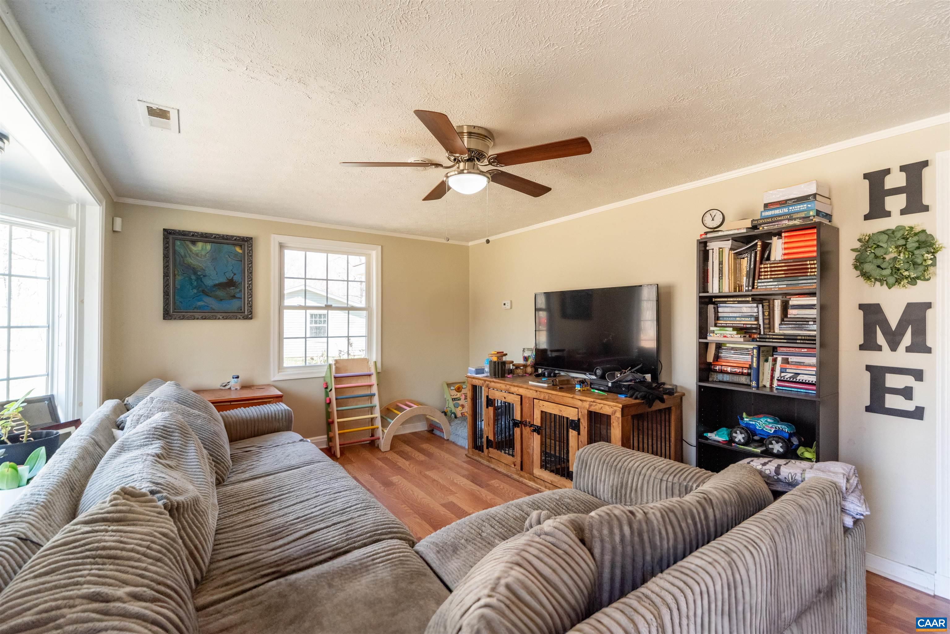 950 Apple Grove Road Mineral, VA 23117 - Photo 5 of 37 a living room with furniture and a flat screen tv