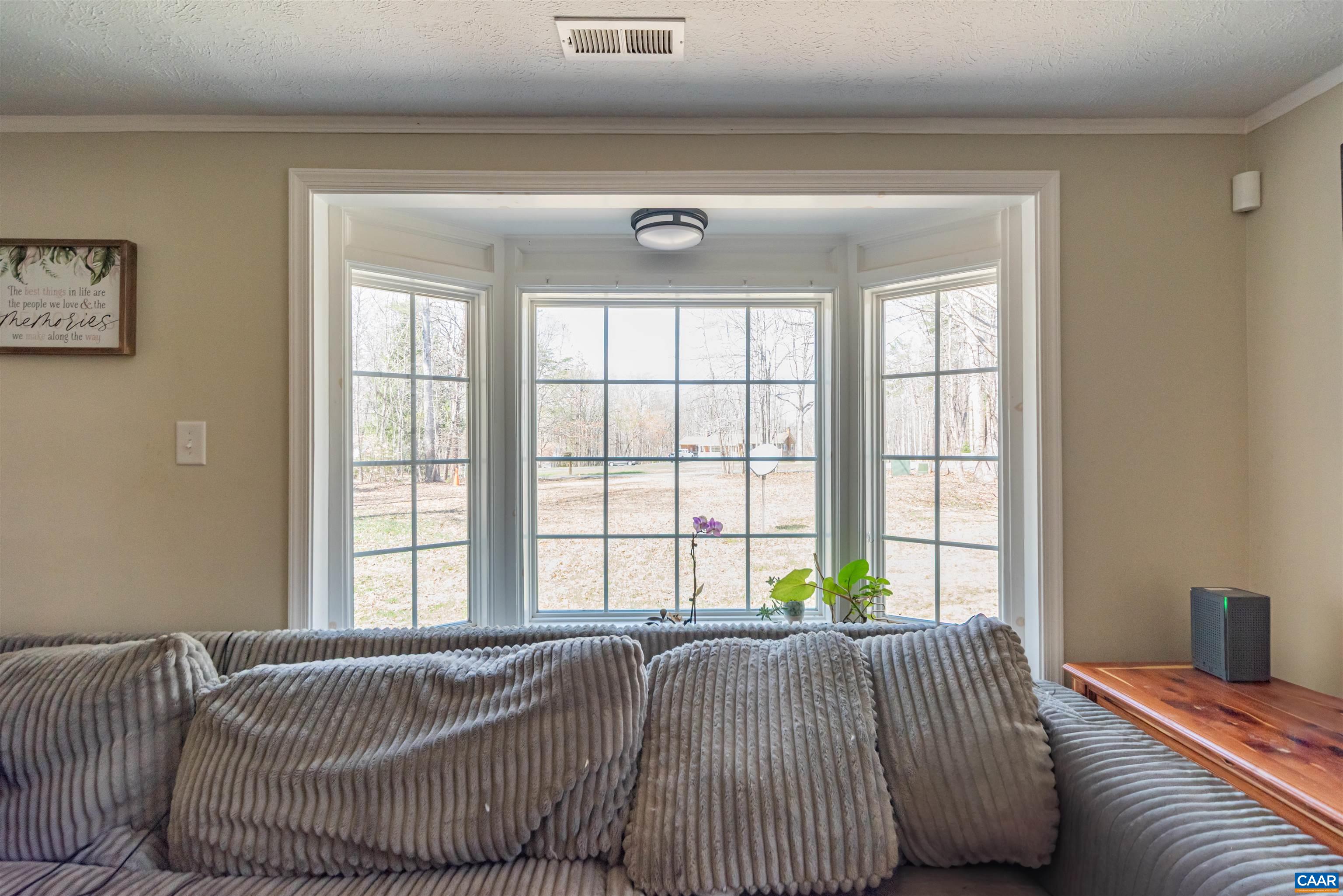 950 Apple Grove Road Mineral, VA 23117 - Photo 6 of 37 a bed sitting in a bedroom next to a window