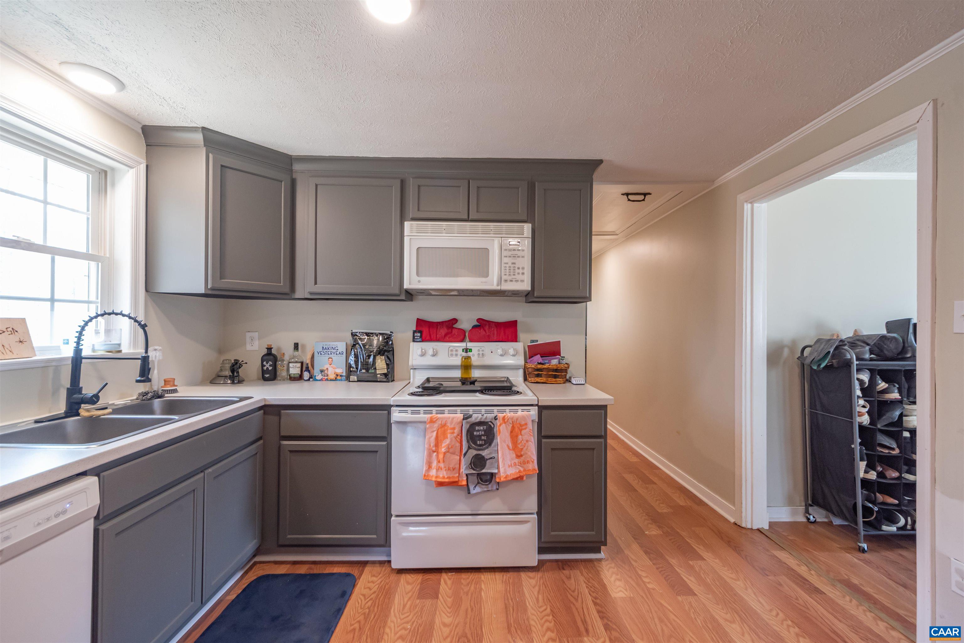 950 Apple Grove Road Mineral, VA 23117 - Photo 9 of 37 a kitchen with stainless steel appliances granite countertop a stove cabinets and wooden floor