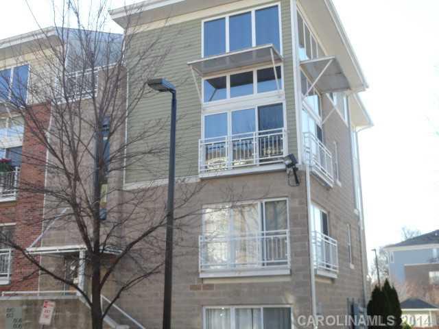 608 Raphael Place, Unit 608 Charlotte, NC 28205 - Photo 1 of 14 a front view of a multi story building