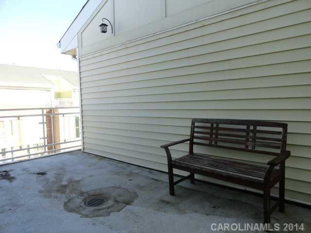 608 Raphael Place, Unit 608 Charlotte, NC 28205 - Photo 13 of 14 a view of a room with a wooden bench
