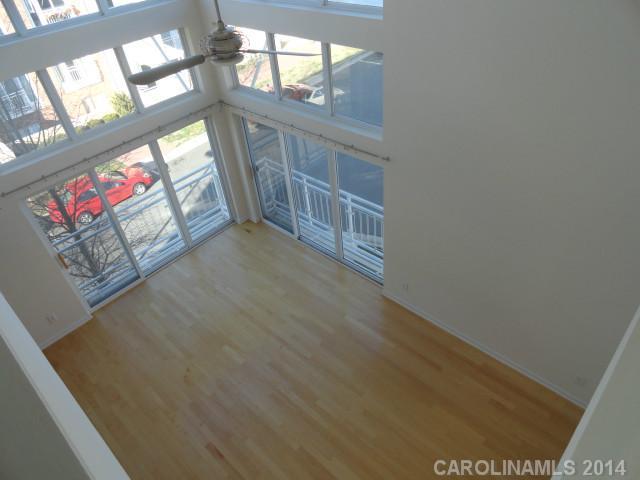 608 Raphael Place, Unit 608 Charlotte, NC 28205 - Photo 4 of 14 a view of an entryway with wooden floor