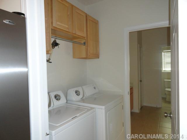 608 Raphael Place, Unit 608 Charlotte, NC 28205 - Photo 6 of 14 a bathroom with a sink and a mirror