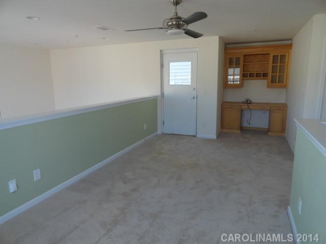 608 Raphael Place, Unit 608 Charlotte, NC 28205 - Photo 8 of 14 an empty room with windows