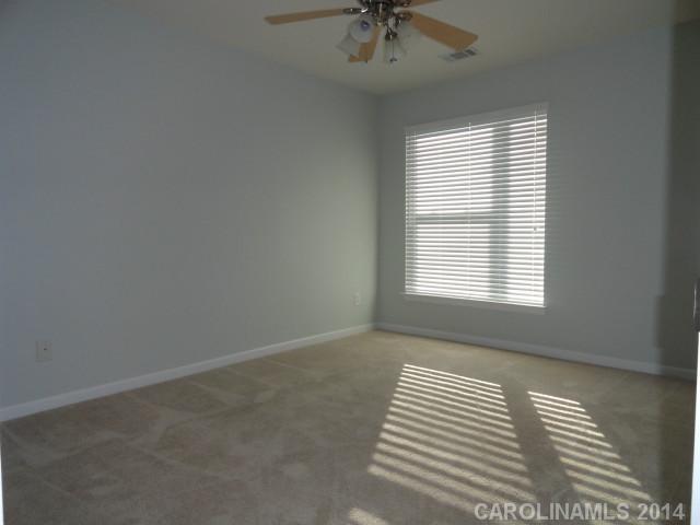 608 Raphael Place, Unit 608 Charlotte, NC 28205 - Photo 10 of 14 an empty room with a window