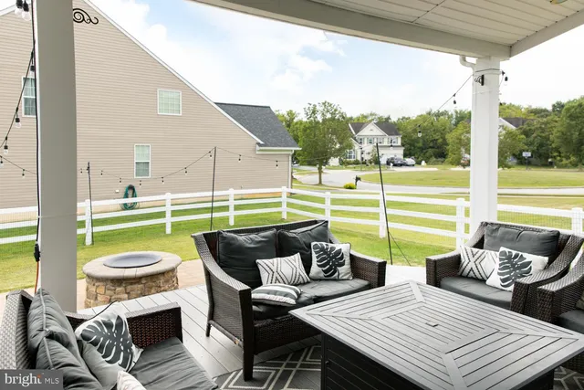 a view of a patio with couches chairs and a table and chairs