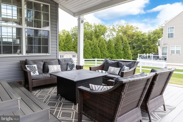 a view of a patio on the deck in front of house