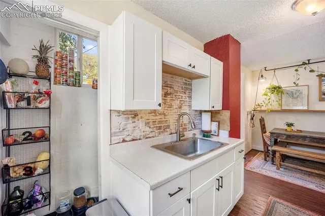 a kitchen with a sink and a refrigerator