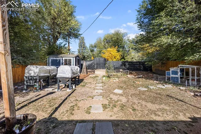 a view of a backyard with sitting area and furniture