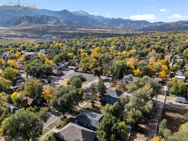 an aerial view of residential house and green space