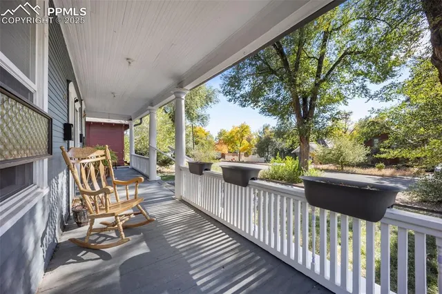 a view of a chair and tables in the balcony