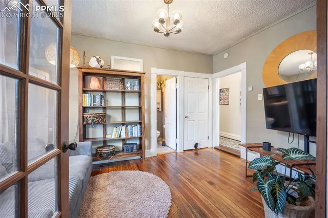 a living room with fireplace furniture and a flat screen tv