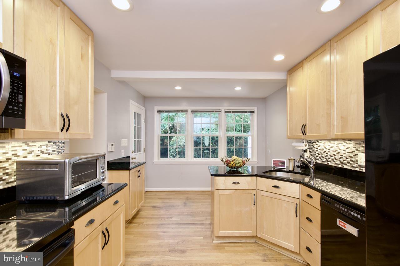 6613 Kerns Road Falls Church, VA 22042 - Photo 11 of 48 a large white kitchen with a large window