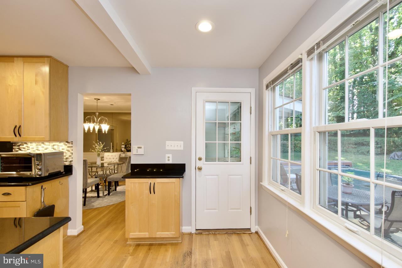 6613 Kerns Road Falls Church, VA 22042 - Photo 14 of 48 a view of a living room kitchen and a large window