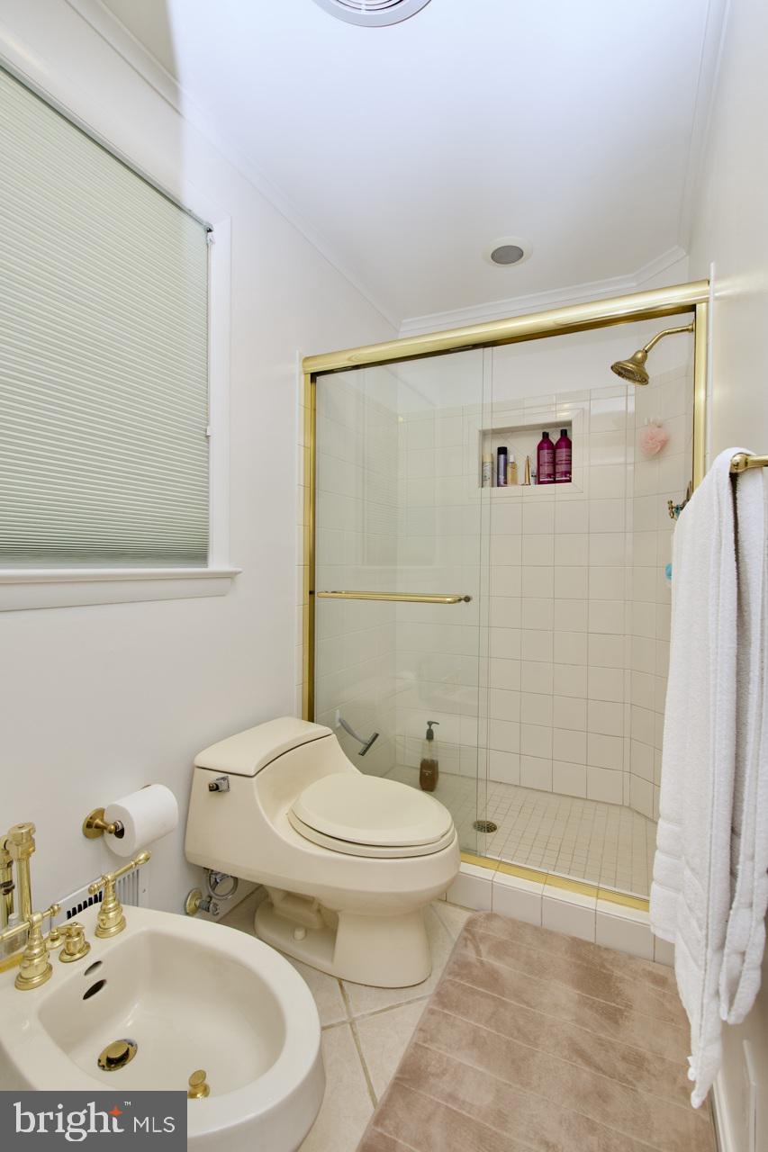 6613 Kerns Road Falls Church, VA 22042 - Photo 21 of 48 a bathroom with a sink toilet and shower