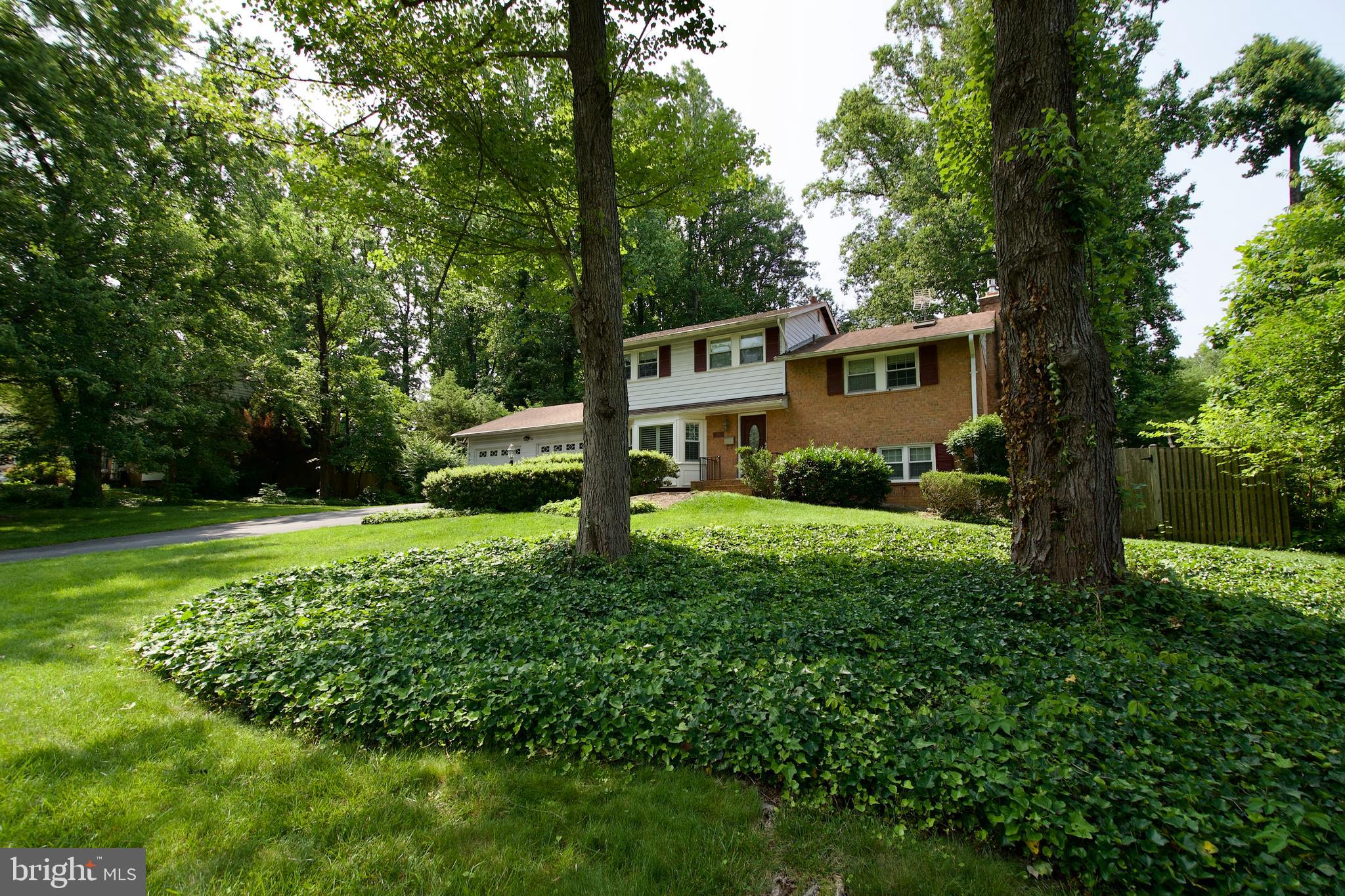 6613 Kerns Road Falls Church, VA 22042 - Photo 41 of 48 a front view of a house with garden