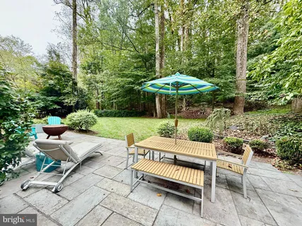 a kitchen with stainless steel appliances granite countertop lots of counter space and windows